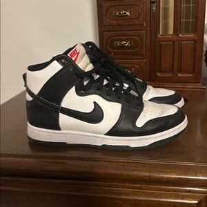 Nike Black and White High-Top Sneakers with Red Tongue Logo